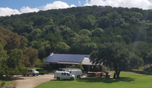 solar panels installed on home surrounded by trees
