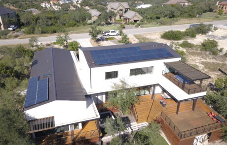 Aerial view of modern home with installed solar panels