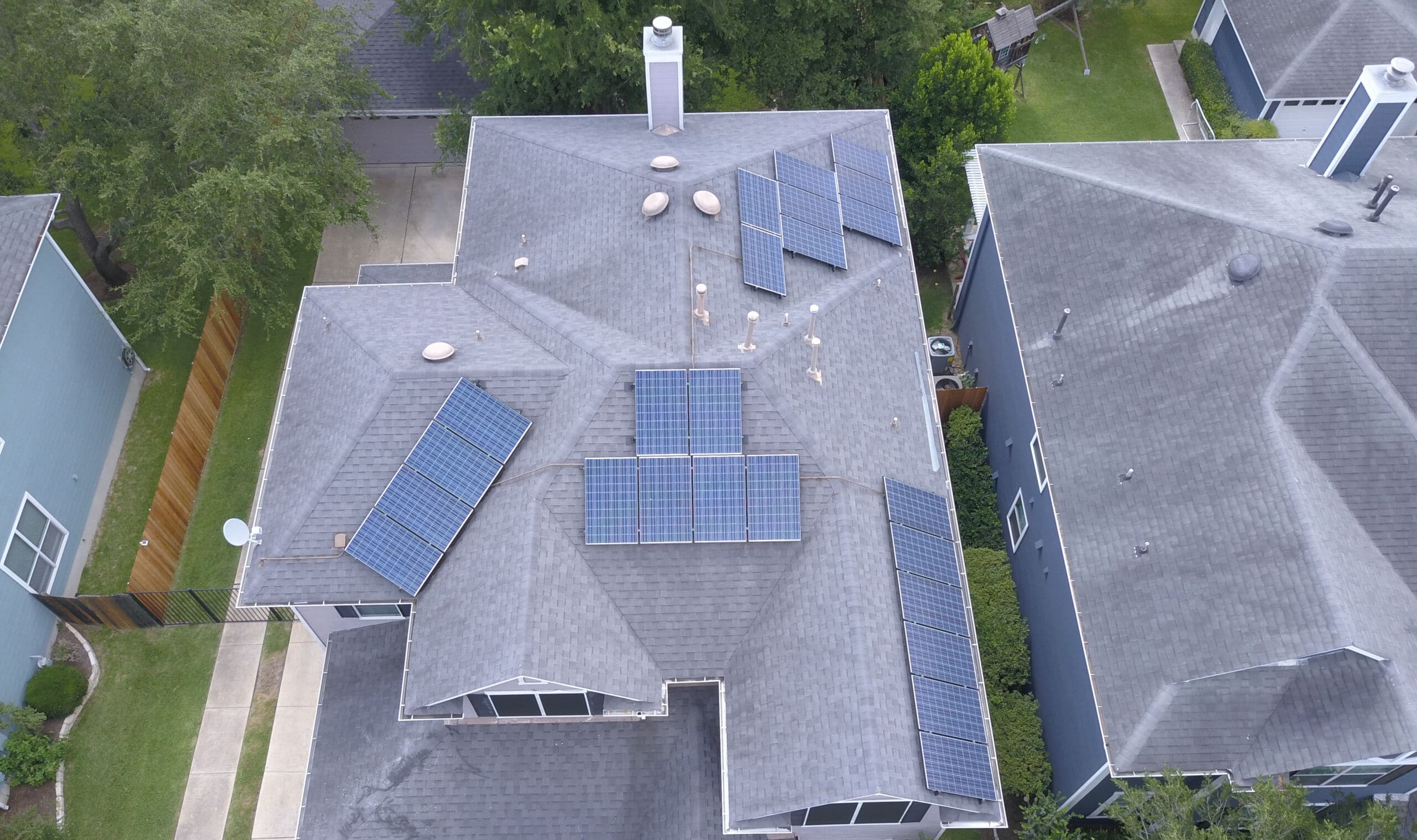 Aerial view of home with solar panels installed